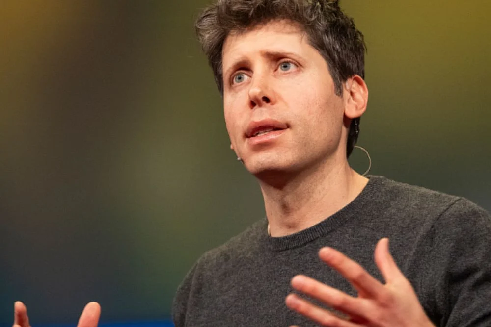 Sam Altman speaking at a tech event while discussing OpenAI and the idea of going public